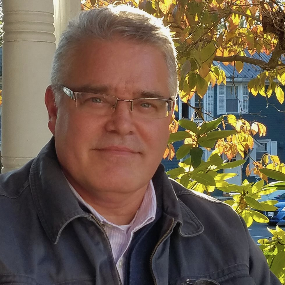 Man with glasses outdoors in autumn