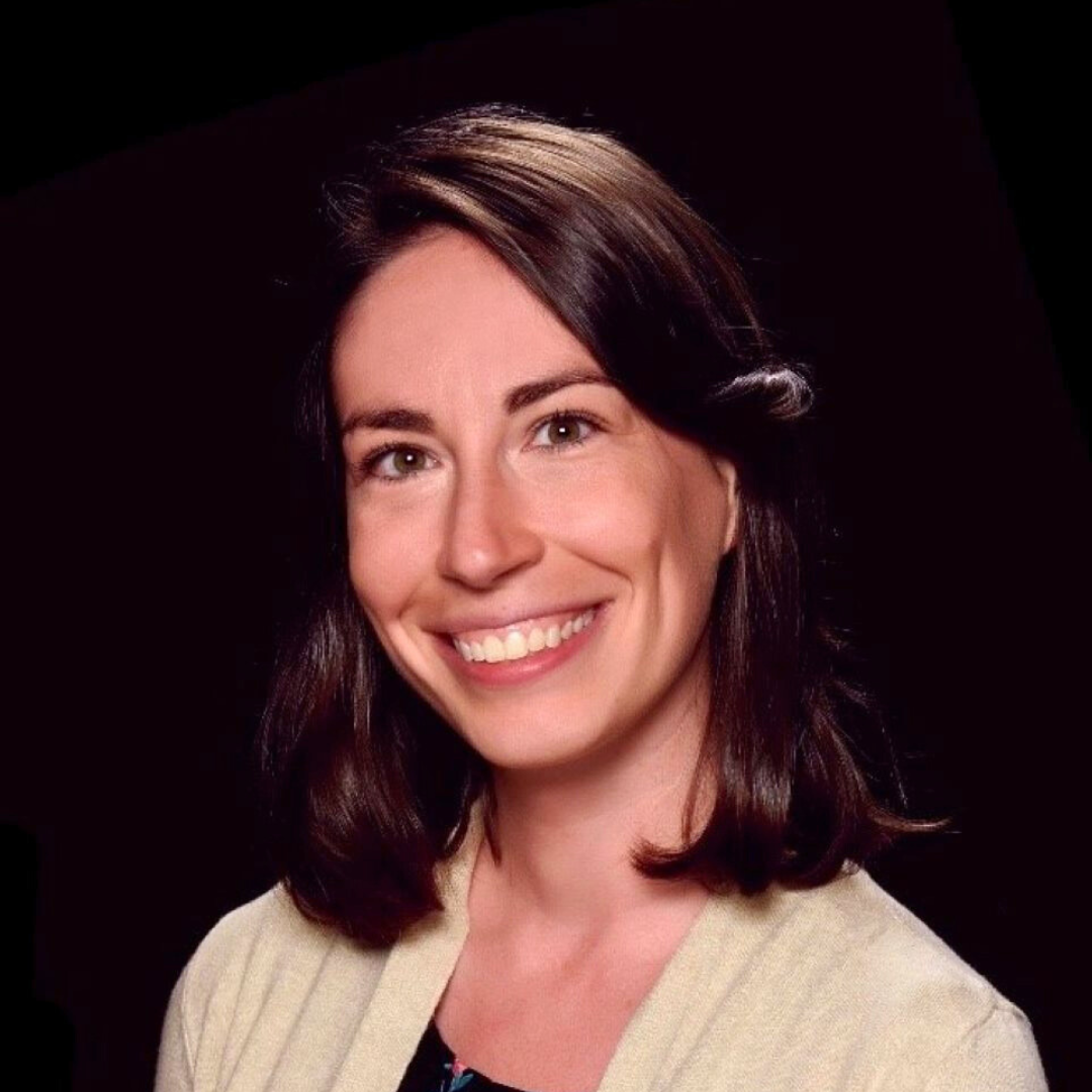 Smiling woman with dark shoulder-length hair