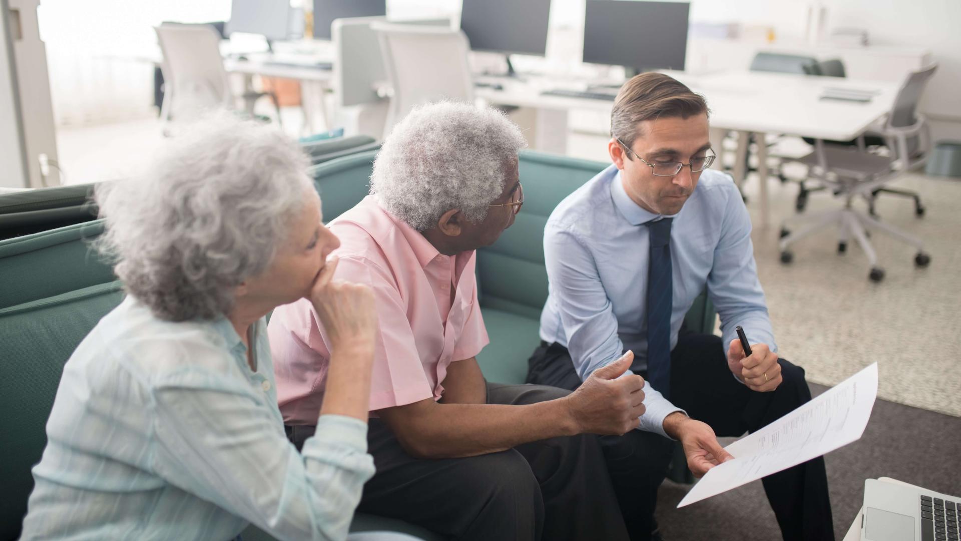 Healthcare professional reviewing information with older adults