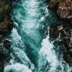 A photograph of a fast-moving river