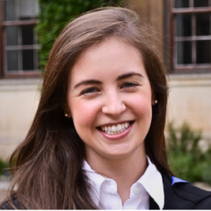 Smiling woman outdoors in professional attire
